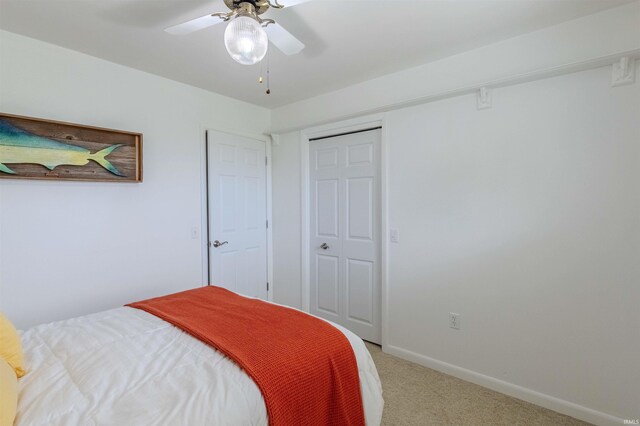 906 N Townline Rd, Lagrange, IN 46761 - bedroom featuring light carpet, a ceiling fan, and a closet