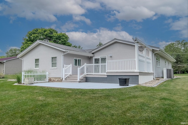 906 N Townline Rd, Lagrange, IN 46761 - rear view of house featuring a patio, a wooden deck, and a yard