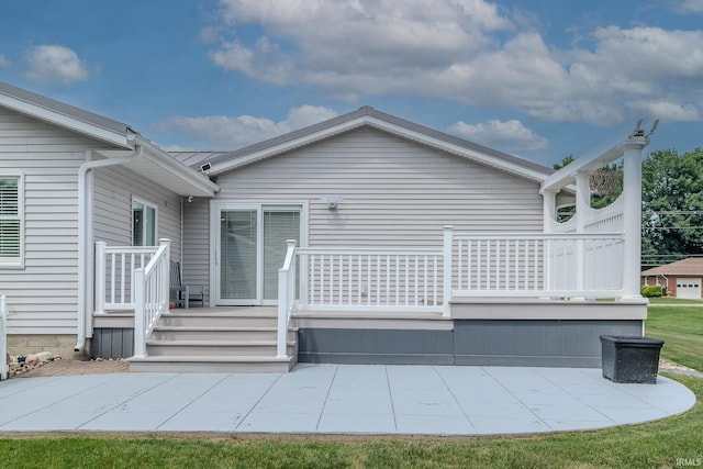 906 N Townline Rd, Lagrange, IN 46761 - rear view of house with a patio and a deck