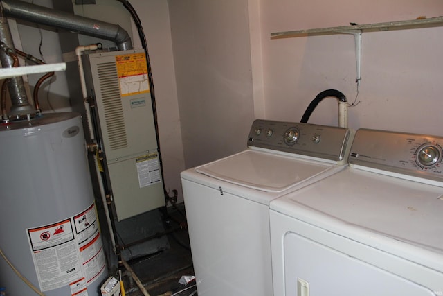 2012 S Vine St, Muncie, IN 47302 - washroom with water heater and separate washer and dryer