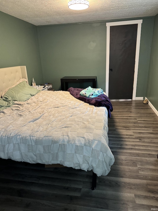 562 Railroad St, Wabash, IN 46992 - bedroom with wood finished floors and a textured ceiling
