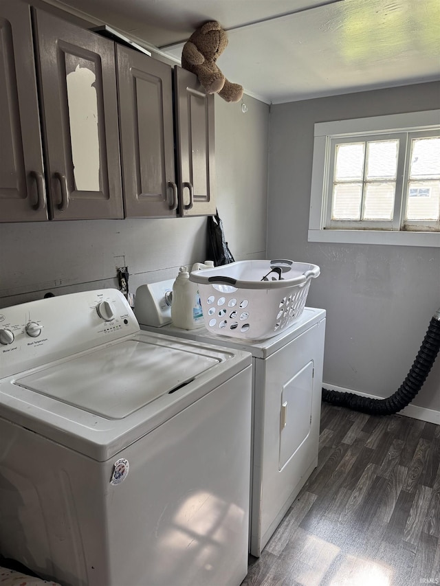 562 Railroad St, Wabash, IN 46992 - washroom with cabinet space, washing machine and clothes dryer, and dark wood-type flooring