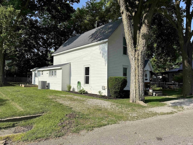 562 Railroad St, Wabash, IN 46992 - view of property exterior with a central air condition unit and roof with shingles