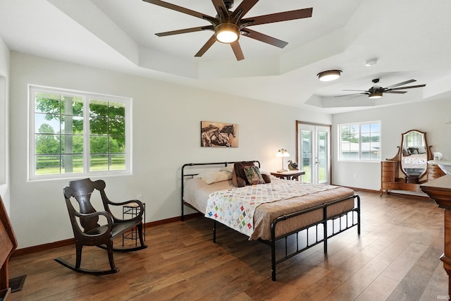 14743 Leesburg Rd, Fort Wayne, IN 46818 - bedroom with a tray ceiling, wood finished floors, and ceiling fan
