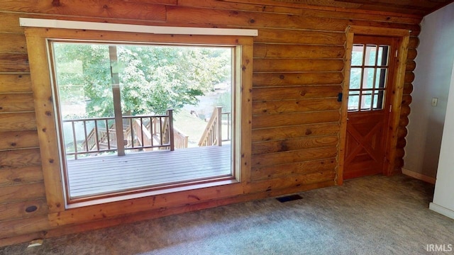 4115 N Aquarius Dr, Monticello, IN 47960 - empty room featuring carpet flooring and rustic walls