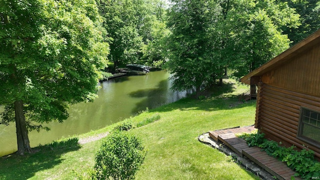 4115 N Aquarius Dr, Monticello, IN 47960 - view of green lawn featuring a deck with water view