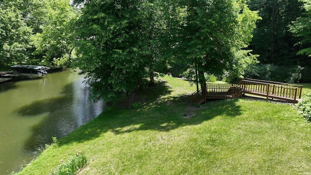 4115 N Aquarius Dr, Monticello, IN 47960 - view of grassy yard featuring a deck with water view