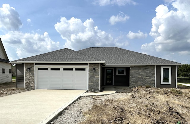 1466 Monte Carlo Dr, Huntertown, IN 46748 - view of front of home with stone siding, a shingled roof, driveway, and a garage