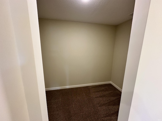 1466 Monte Carlo Dr, Huntertown, IN 46748 - empty room with dark colored carpet and a textured ceiling