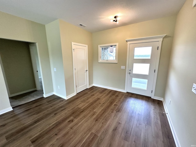 1466 Monte Carlo Dr, Huntertown, IN 46748 - foyer featuring dark wood-type flooring and baseboards