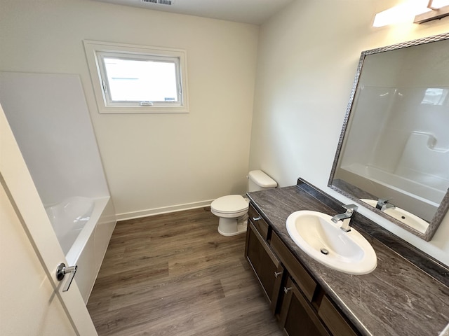 1466 Monte Carlo Dr, Huntertown, IN 46748 - bathroom featuring vanity, wood finished floors, and shower / bath combination