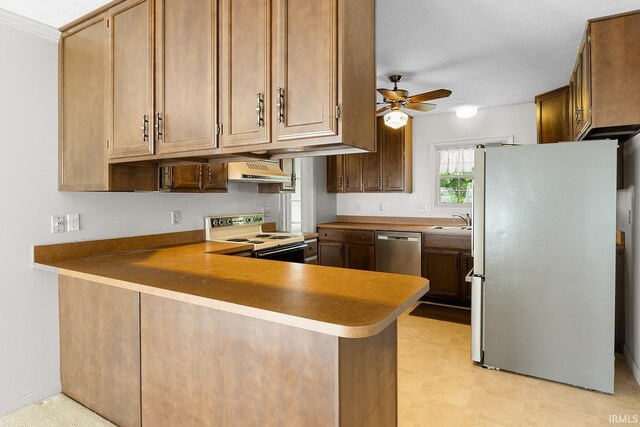 106 W Navajo St, West Lafayette, IN 47906 - kitchen featuring appliances with stainless steel finishes, range hood, a ceiling fan, a peninsula, and light floors