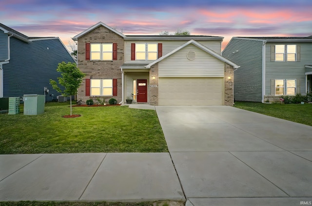 140 Wadsworth Ct, Lafayette, IN 47905 - traditional home featuring brick siding, driveway, a front lawn, and an attached garage