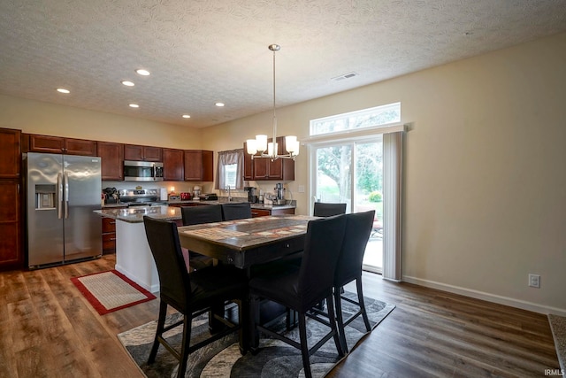 140 Wadsworth Ct, Lafayette, IN 47905 - dining room with a chandelier, dark wood-style flooring, a textured ceiling, and recessed lighting