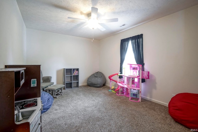 140 Wadsworth Ct, Lafayette, IN 47905 - recreation room with ceiling fan, carpet floors, and a textured ceiling