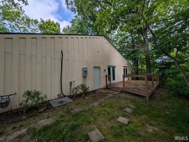7201 S Kingswood St, Terre Haute, IN 47802 - rear view of house with board and batten siding and a wooden deck