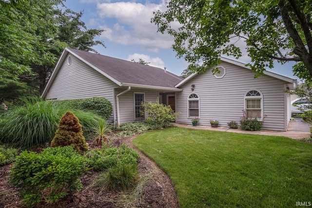 3718 Grasstree Ct, Bloomington, IN 47401 - ranch-style home with a front yard and roof with shingles