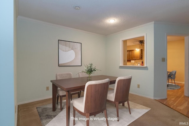 3718 Grasstree Ct, Bloomington, IN 47401 - carpeted dining room with ornamental molding, a textured ceiling, and a ceiling fan