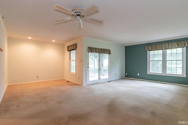 3718 Grasstree Ct, Bloomington, IN 47401 - spare room featuring plenty of natural light, light carpet, crown molding, a ceiling fan, and recessed lighting