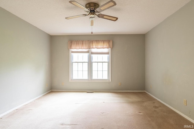 3718 Grasstree Ct, Bloomington, IN 47401 - carpeted empty room with a textured ceiling and a ceiling fan
