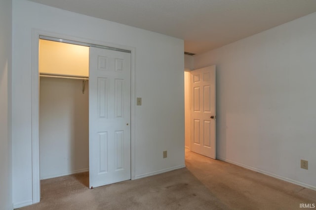 3718 Grasstree Ct, Bloomington, IN 47401 - unfurnished bedroom with light colored carpet and a closet