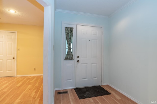 3718 Grasstree Ct, Bloomington, IN 47401 - entryway featuring wood finished floors and ornamental molding
