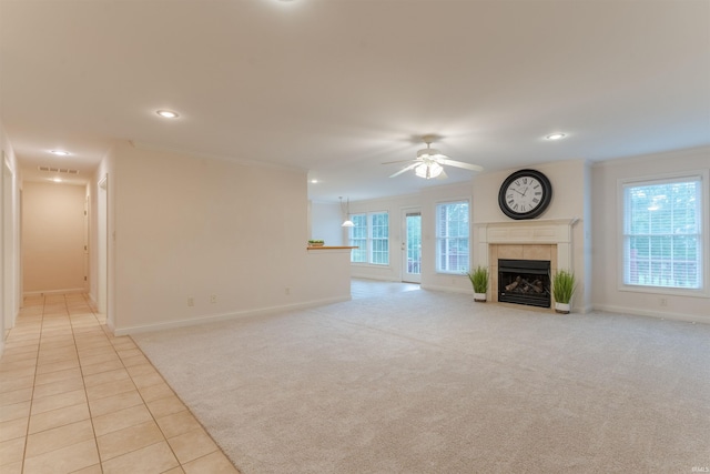7561 Saint Jordan Cir, Newburgh, IN 47630 - unfurnished living room with a fireplace, ceiling fan, recessed lighting, light carpet, and light tile patterned flooring