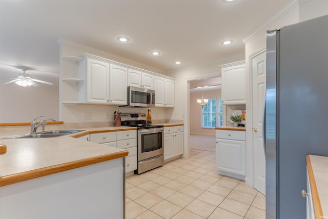 7561 Saint Jordan Cir, Newburgh, IN 47630 - kitchen with appliances with stainless steel finishes, open shelves, white cabinetry, light tile patterned floors, and a ceiling fan