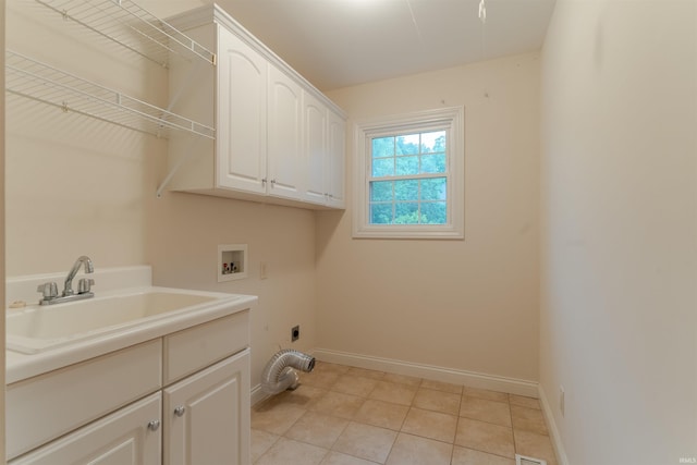 7561 Saint Jordan Cir, Newburgh, IN 47630 - laundry room with washer hookup, cabinet space, electric dryer hookup, and light tile patterned floors