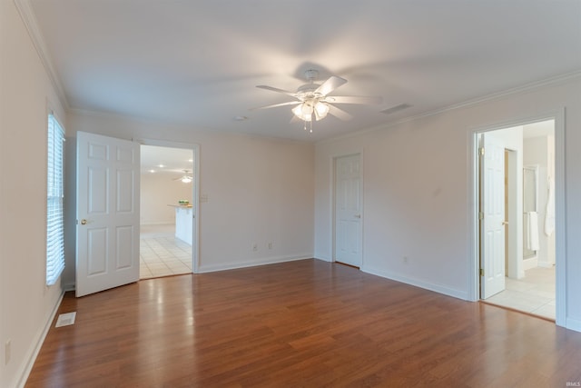 7561 Saint Jordan Cir, Newburgh, IN 47630 - unfurnished bedroom featuring wood finished floors, crown molding, ensuite bath, and a ceiling fan