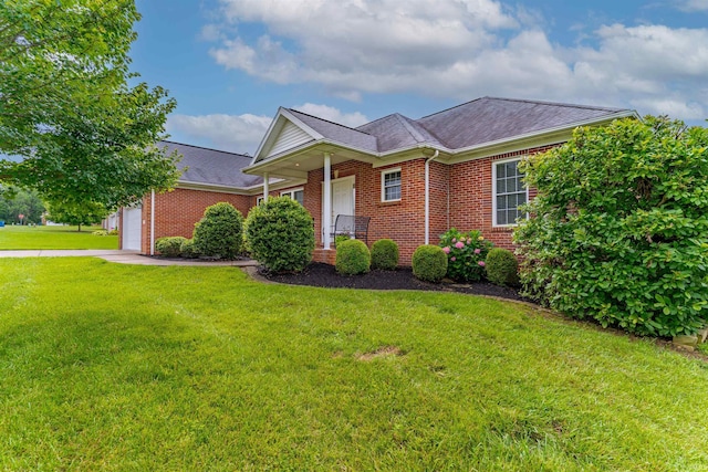 7561 Saint Jordan Cir, Newburgh, IN 47630 - view of front of property with brick siding, a front lawn, a garage, and a shingled roof
