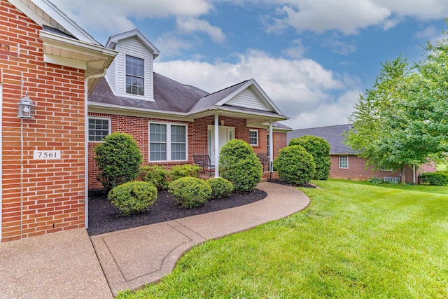 7561 Saint Jordan Cir, Newburgh, IN 47630 - view of front of home with brick siding, a front yard, and roof with shingles