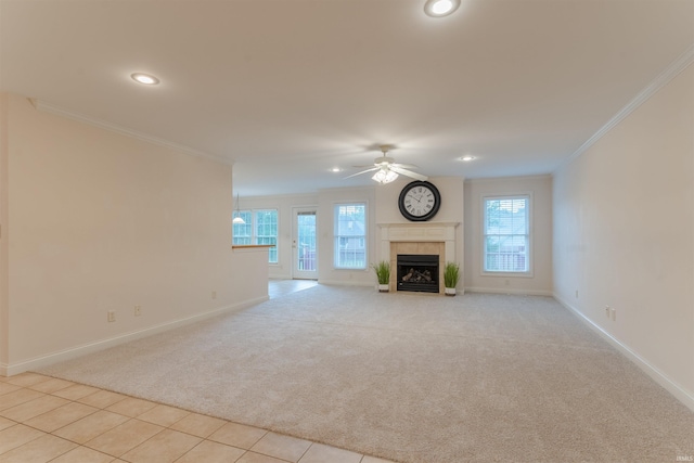 7561 Saint Jordan Cir, Newburgh, IN 47630 - unfurnished living room featuring light colored carpet, ceiling fan, crown molding, recessed lighting, and a tile fireplace