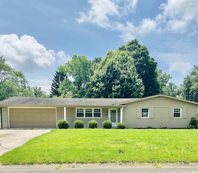 2301 W Norwood Dr, Muncie, IN 47304 - ranch-style house featuring an attached garage, brick siding, a front yard, driveway, and a chimney
