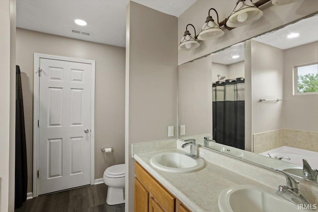 3933 Electra Ct, Lafayette, IN 47905 - full bathroom with a bath, wood finished floors, and double vanity