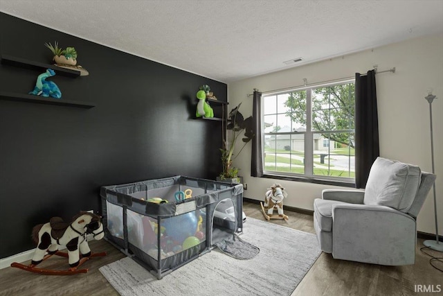 3933 Electra Ct, Lafayette, IN 47905 - bedroom with wood finished floors and a textured ceiling