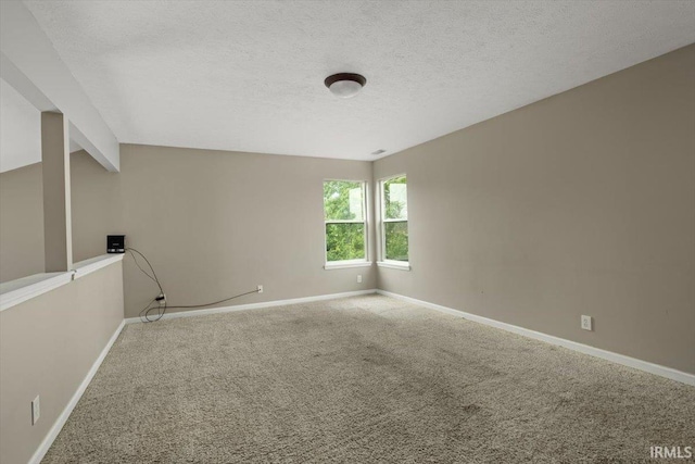 3933 Electra Ct, Lafayette, IN 47905 - unfurnished room featuring carpet floors, a textured ceiling, and beam ceiling