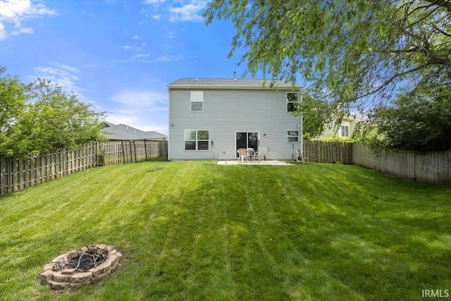 3933 Electra Ct, Lafayette, IN 47905 - rear view of house featuring an outdoor fire pit, a patio area, and a fenced backyard