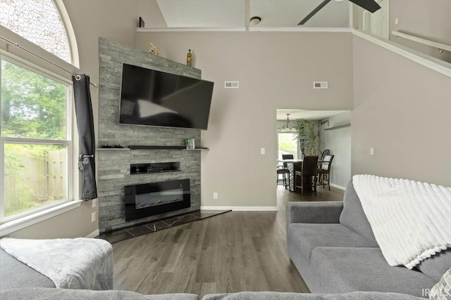 3933 Electra Ct, Lafayette, IN 47905 - living area with a high ceiling, wood finished floors, a fireplace, and ceiling fan