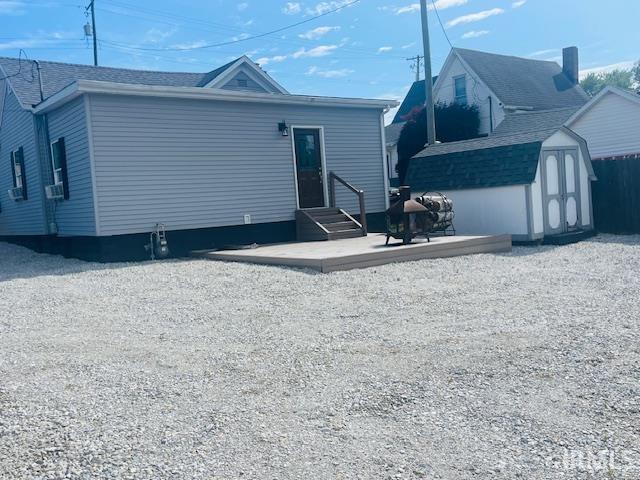 608 W Main St, Greentown, IN 46936 - back of house with a storage shed, entry steps, and a patio