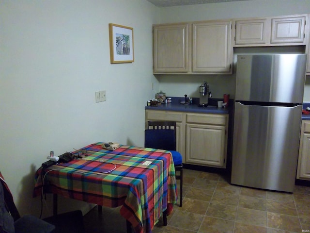 917 N Maple St, Bloomington, IN 47404 - kitchen featuring freestanding refrigerator and dark countertops