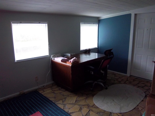 917 N Maple St, Bloomington, IN 47404 - home office featuring plenty of natural light and light stone finish flooring