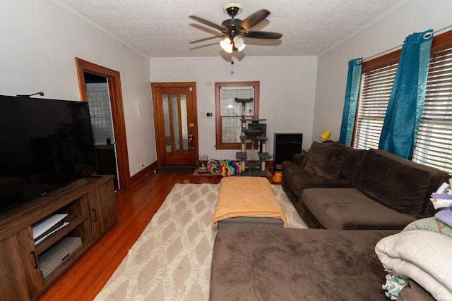 1121 S 23rd St, South Bend, IN 46615 - living area with wood finished floors, a ceiling fan, and crown molding