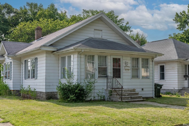 1121 S 23rd St, South Bend, IN 46615 - view of front of property with a chimney, a front lawn, and roof with shingles