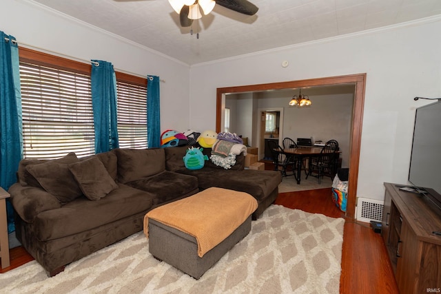 1121 S 23rd St, South Bend, IN 46615 - living area featuring wood finished floors, ceiling fan, crown molding, and a chandelier