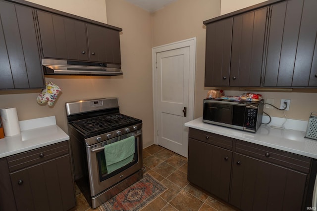 1121 S 23rd St, South Bend, IN 46615 - kitchen with appliances with stainless steel finishes, under cabinet range hood, light countertops, and dark brown cabinets