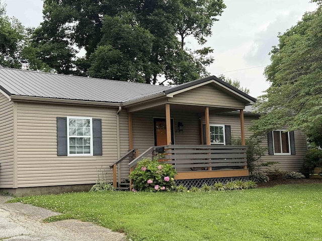 701 E Water St, Princeton, IN 47670 - bungalow-style house with a front lawn, a metal roof, and covered porch