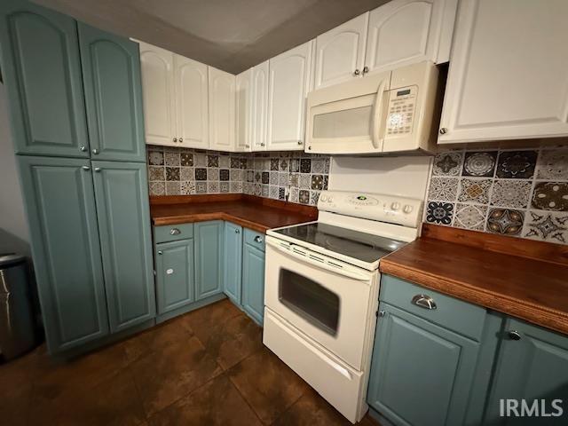 701 E Water St, Princeton, IN 47670 - kitchen featuring white appliances, butcher block counters, blue cabinets, tasteful backsplash, and white cabinetry