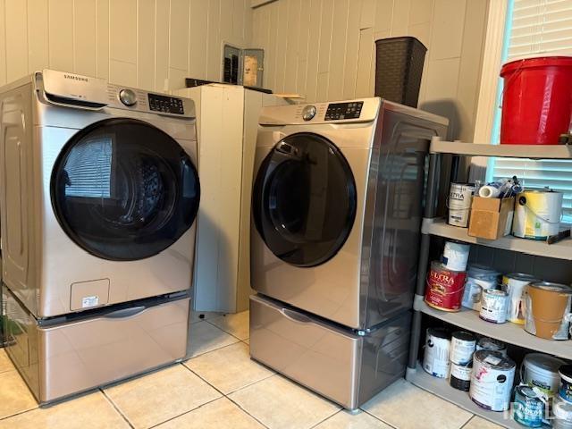 701 E Water St, Princeton, IN 47670 - laundry room featuring washing machine and dryer and light tile patterned flooring
