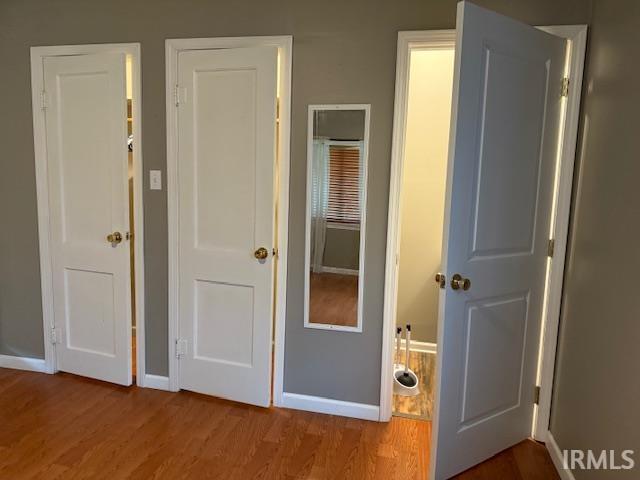 701 E Water St, Princeton, IN 47670 - unfurnished bedroom with wood finished floors